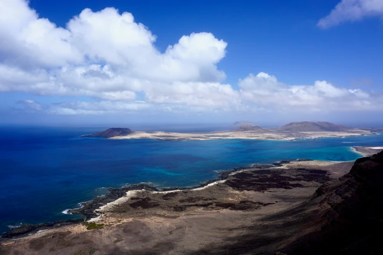 an area that has some water and a big hill