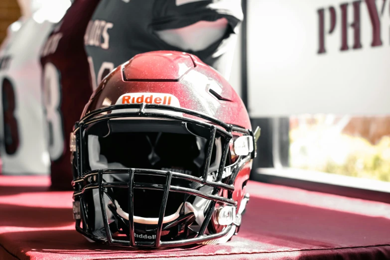 a football helmet sitting on top of a table