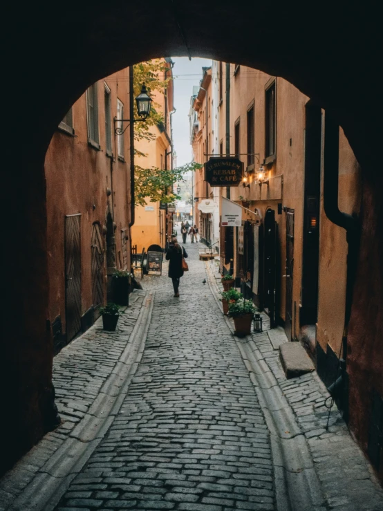 an arch in the street looks to be on a dark side