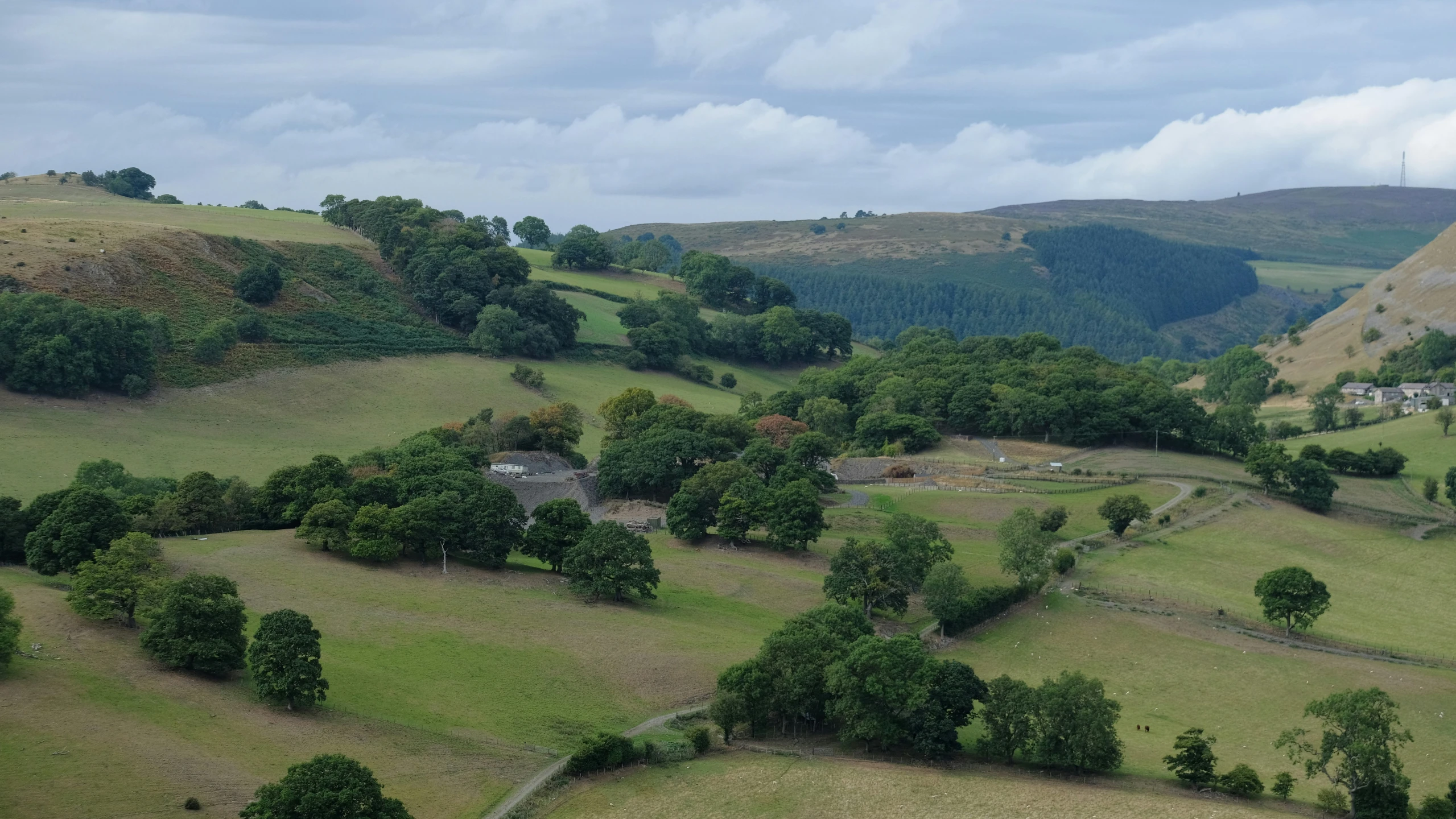 a valley with some hills in the background