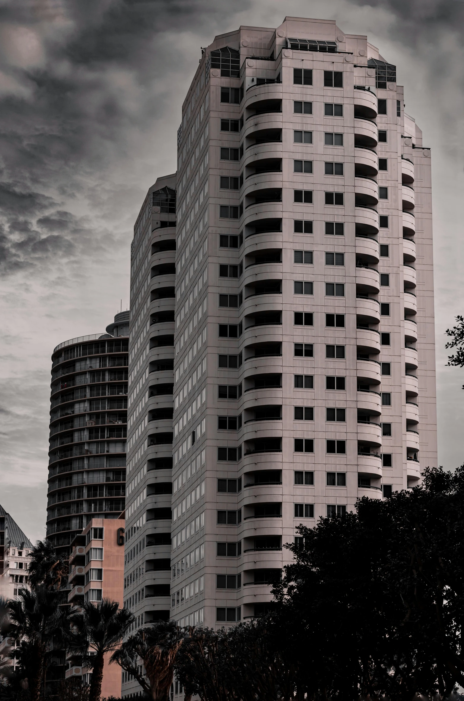 a group of high rise buildings, against the sky