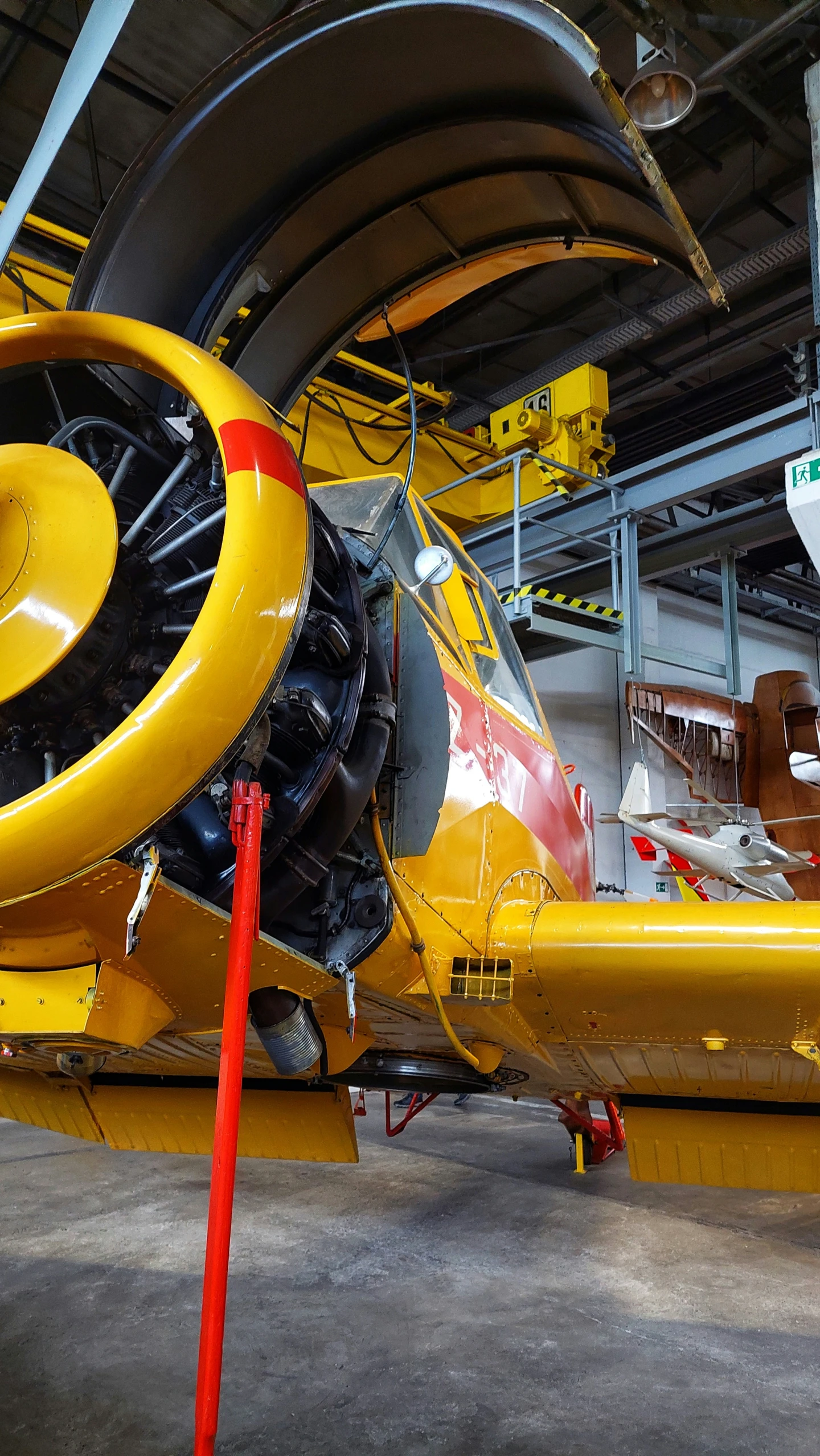 a jet engine in a hangar that is still on the ground