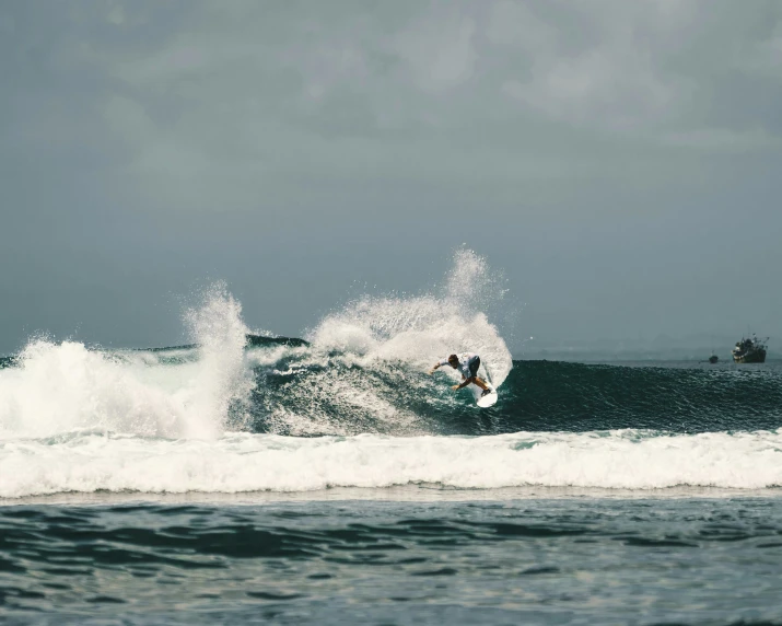 a surfer is riding a large wave in the ocean