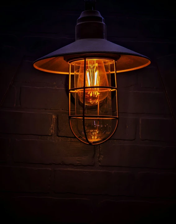 a lamp is shown on a brick wall