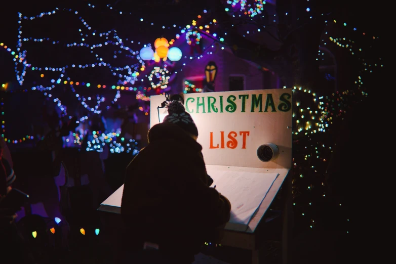 a person sits at a table with some lights on it