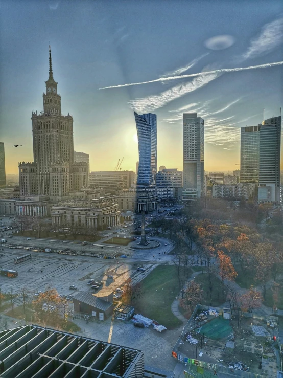 an aerial view of a city at sunset