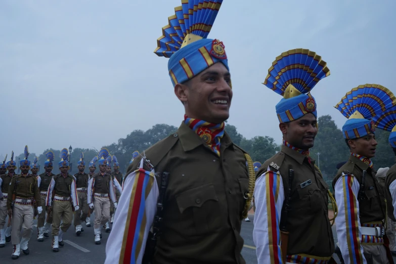 a man standing with a group of soldiers in uniform