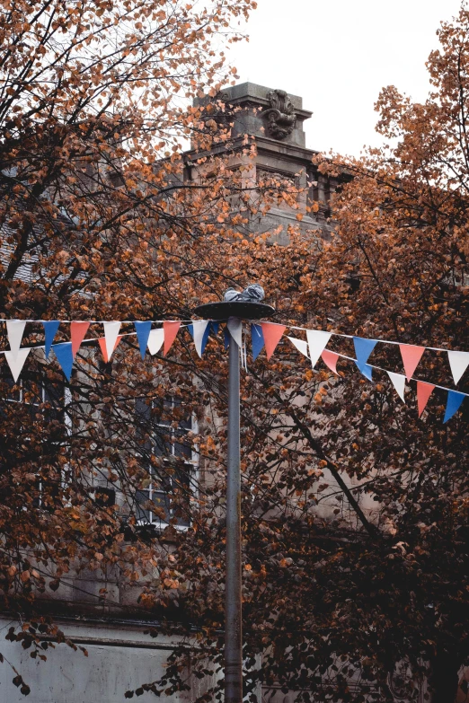 a red, white, and blue bunting beside a building