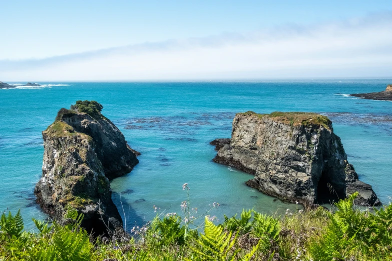 an open body of water surrounded by a cliff