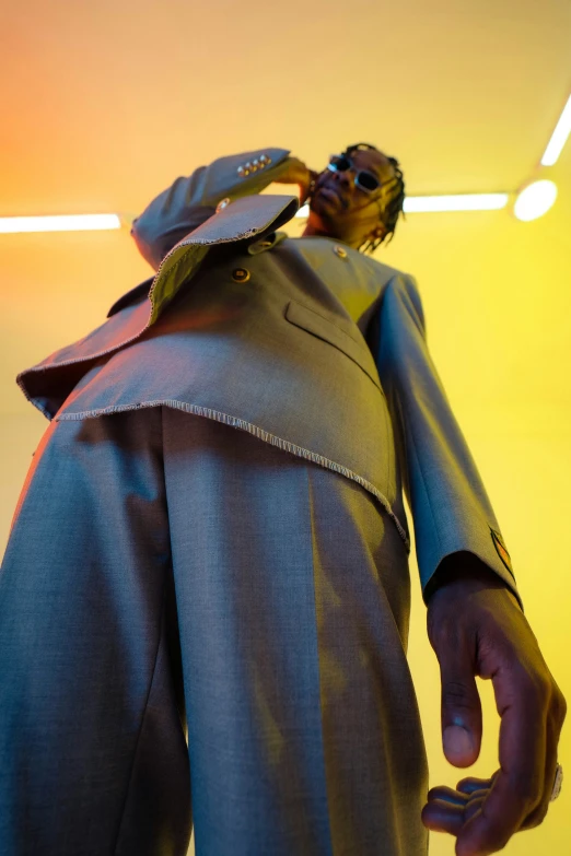 a statue wearing a suit with a tie and sunglasses