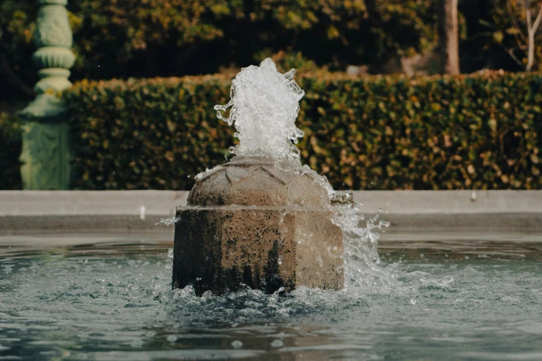 a close up of a fountain spouts water