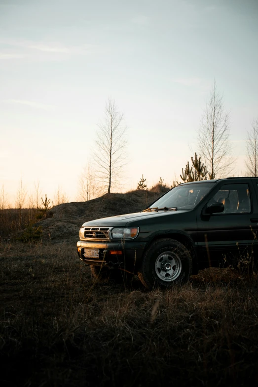 a truck is parked in the middle of a field