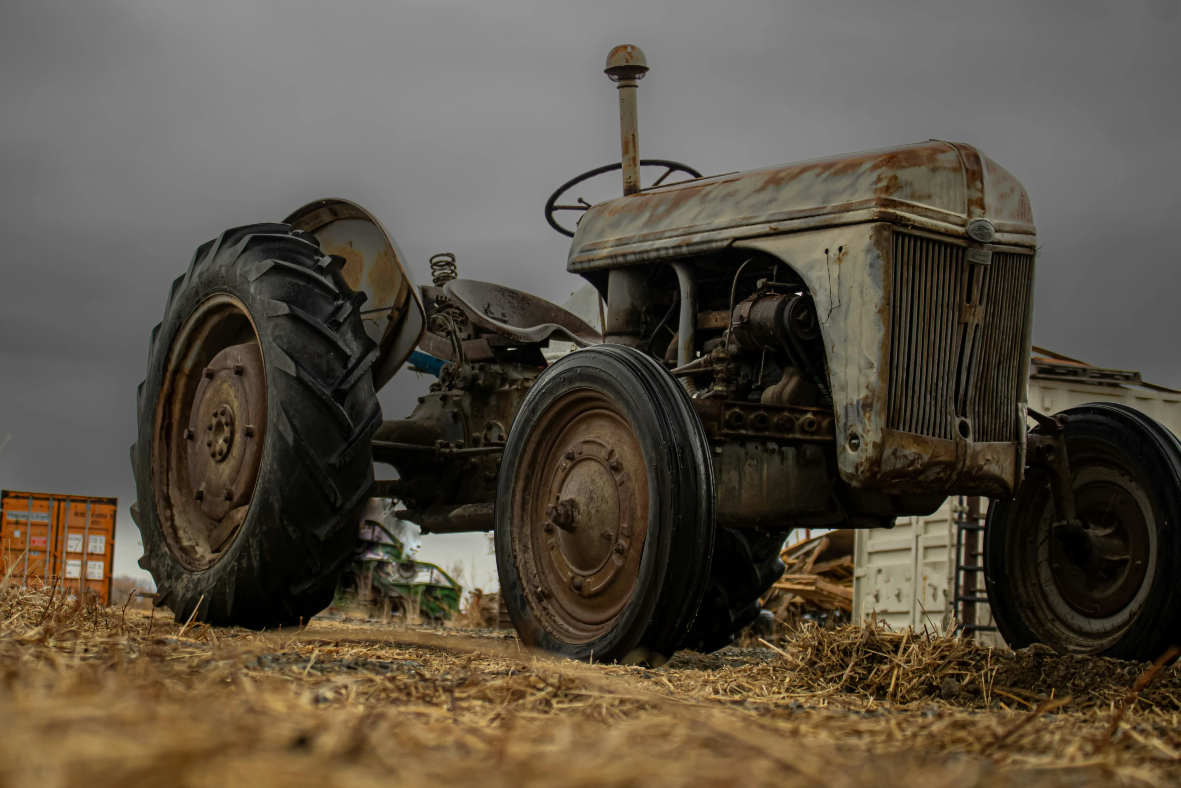 a vintage farmall tractor parked in a field
