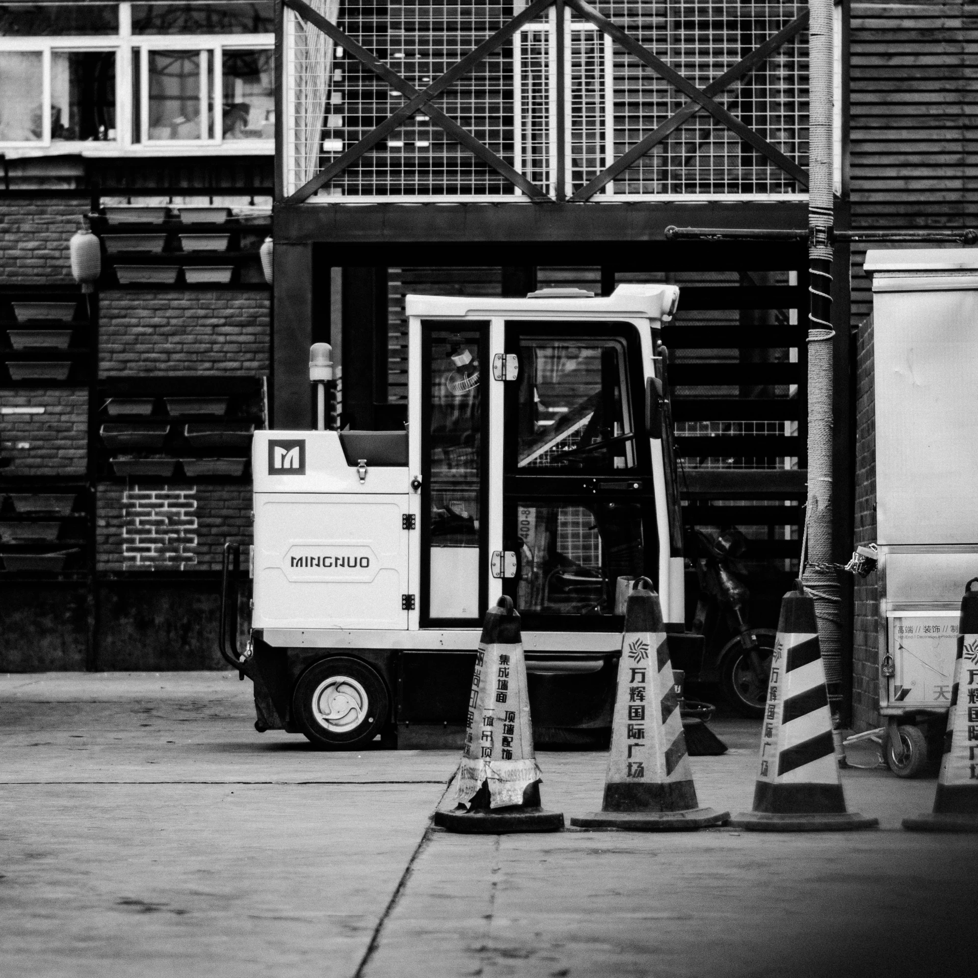 a large white truck with two barriers near it