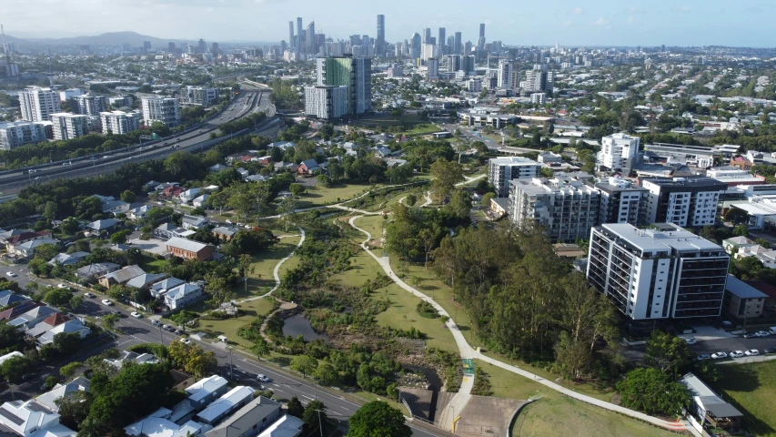 a large city has very tall buildings and lots of trees