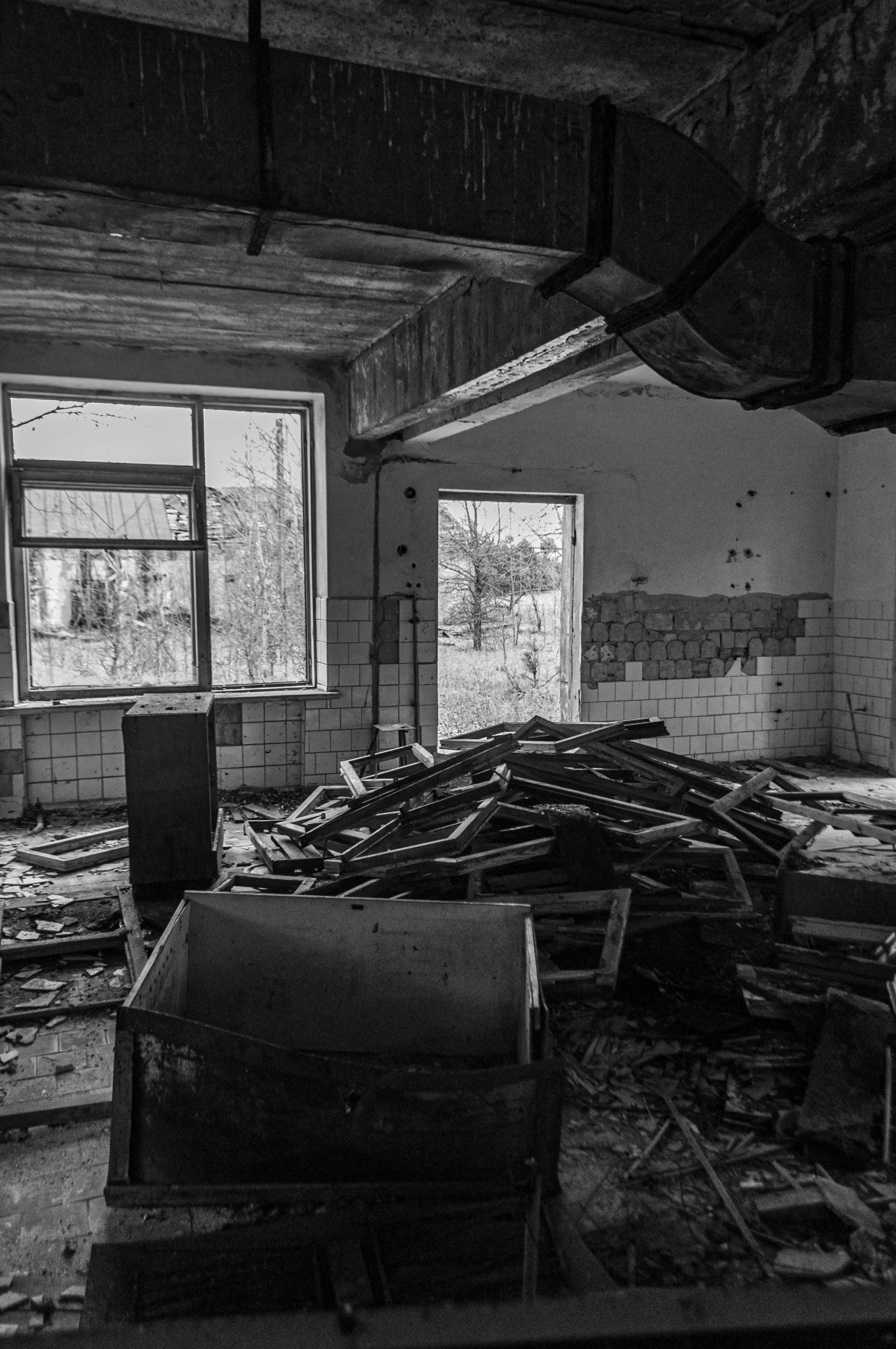 the interior of an abandoned building with broken windows