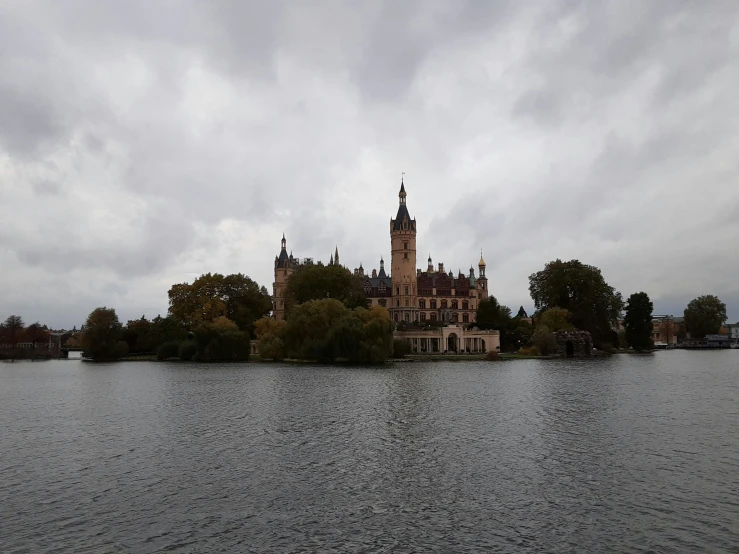 an image of a castle with a lake in front of it