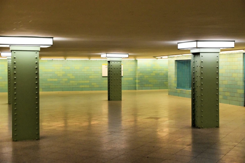 an empty underground area with metal fixtures