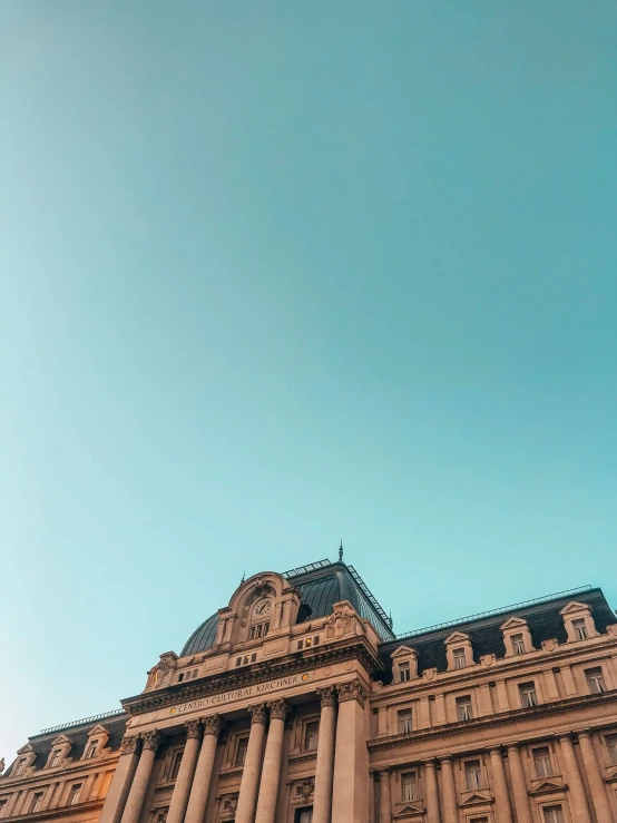 a tall building with some columns on top