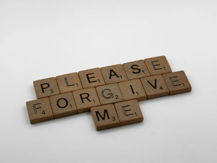 letters are placed on top of each other on wood type blocks