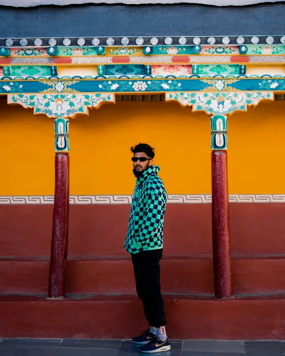 a man that is standing near some poles