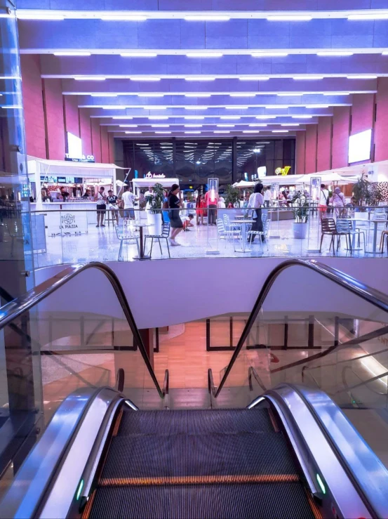 an escalator is in a large lobby