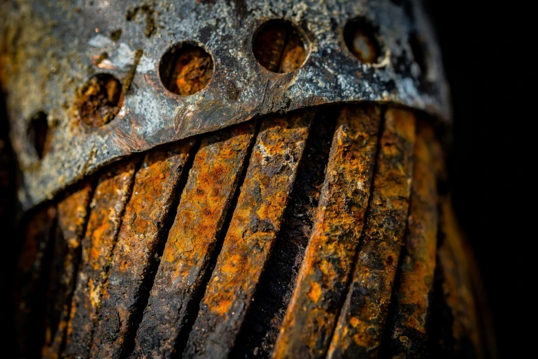 an old rusty fire hydrant in the dark