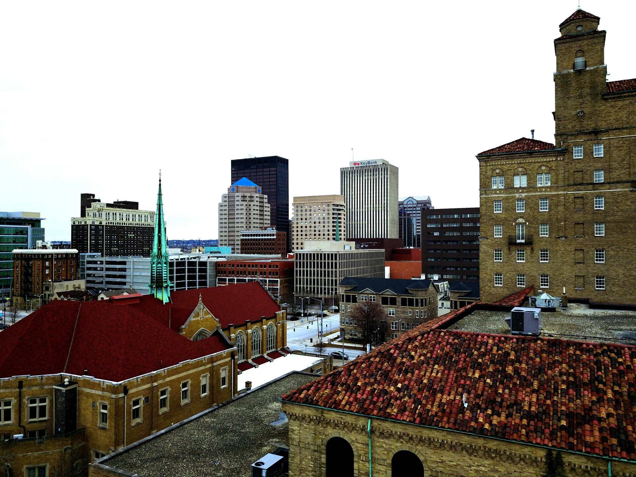 a building with a red roof that is near another building