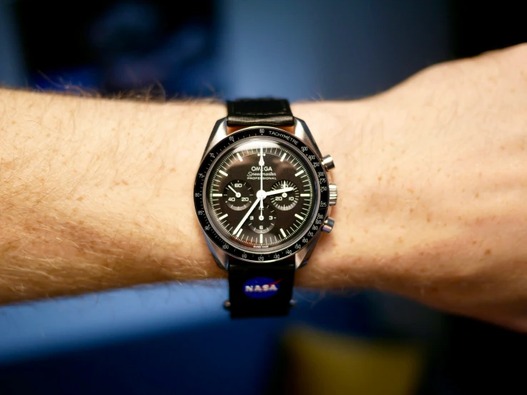 a watch on a man's wrist is black