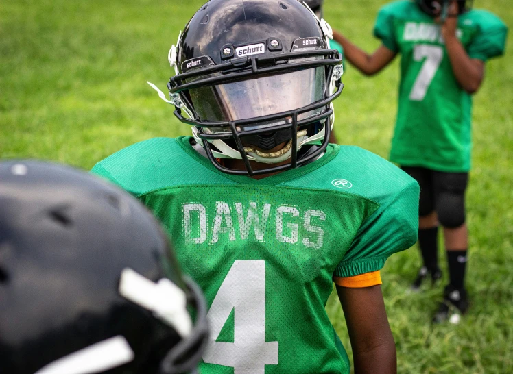 some s in their football uniforms