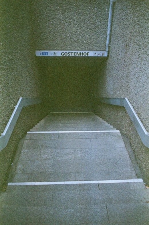 the inside of an empty room that has a metal ladder