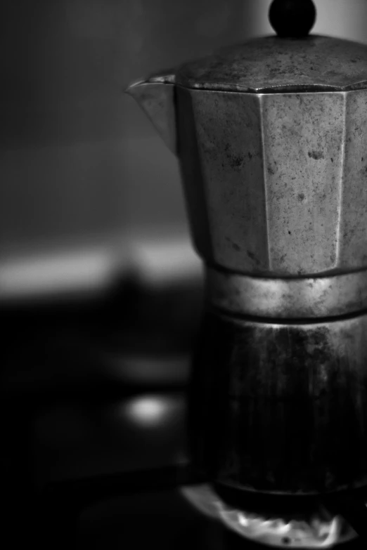 a stove with a coffee pot on the stove