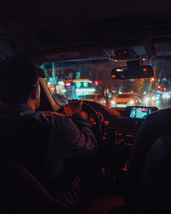 a person driving a vehicle on a dark street