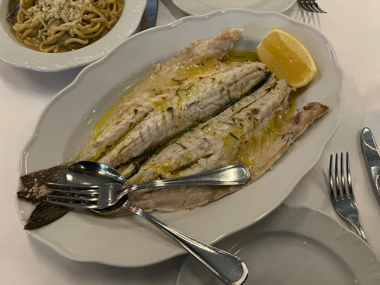 a white plate topped with food on top of a table