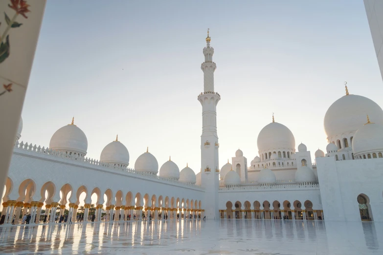 an intricately white building with pillars and arches