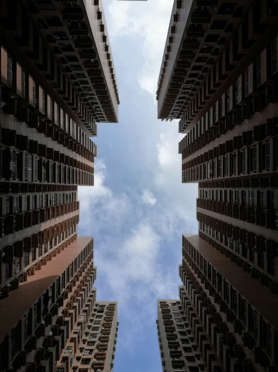 a looking up at the building in a city