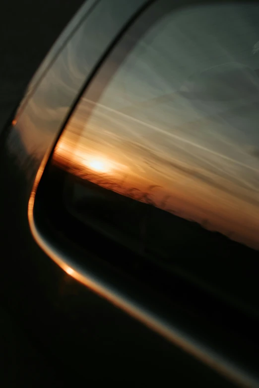 the wing of a vehicle is seen from the side mirror