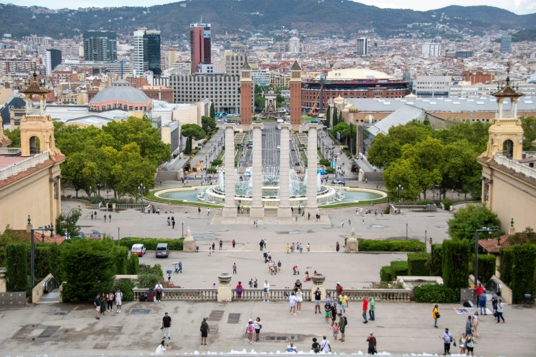 the view of the buildings from above, shows the main square with fountains in the middle