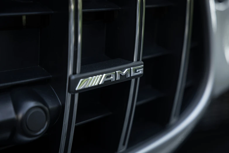 a grille from the side of a car with a gmc emblem