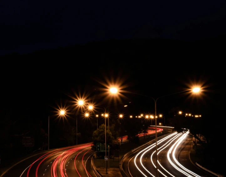 a city street with bright lights and traffic