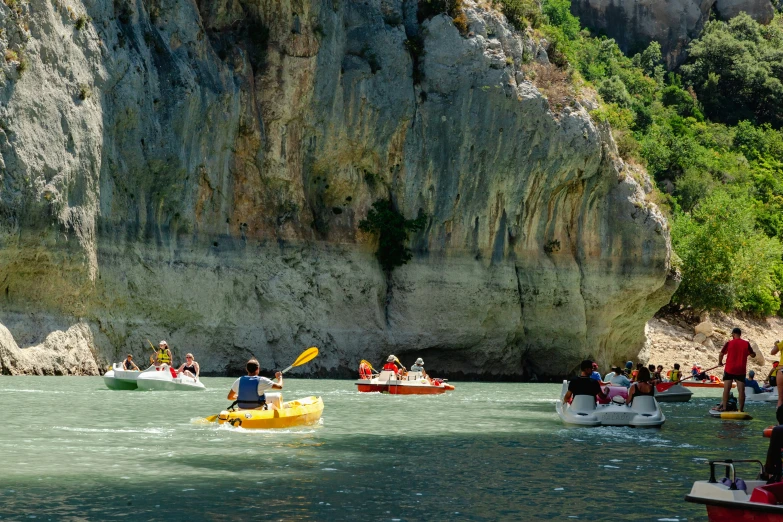 people enjoying an outdoor activity while in a boat