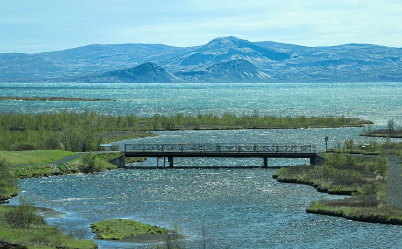 there is a very beautiful view of the mountains and water