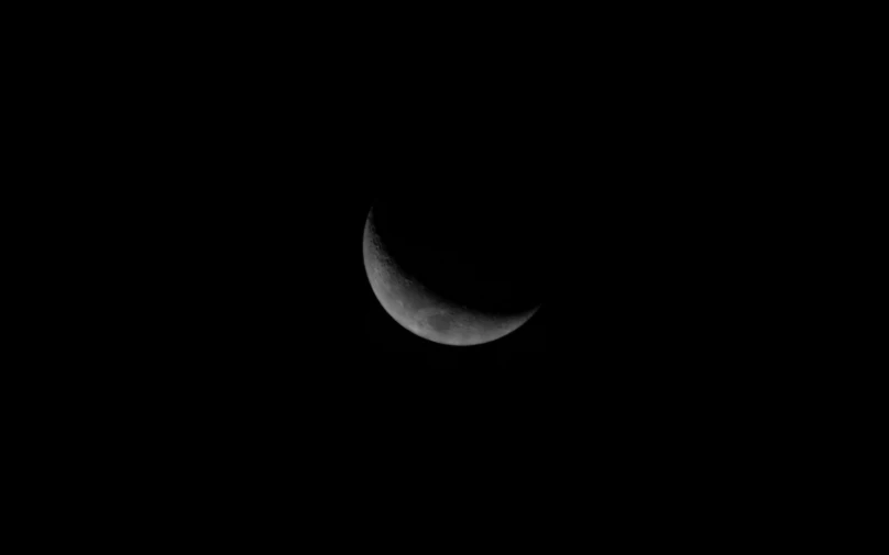 the moon at night showing only a few areas of darkness