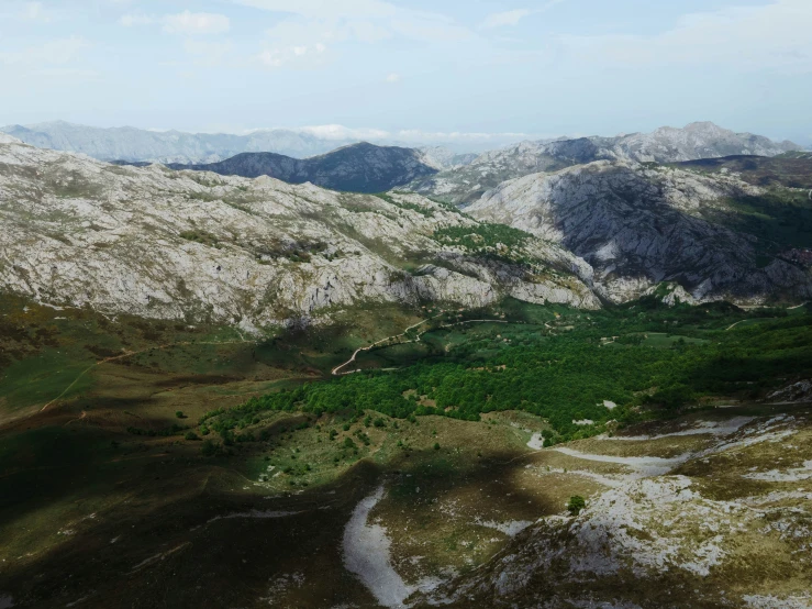 the view of some mountains that are covered in snow