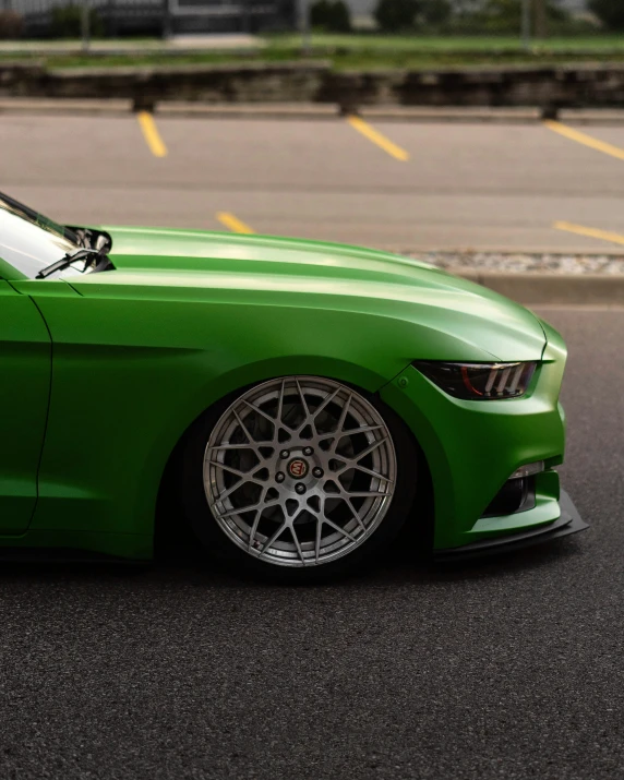 the mustang on the street is painted bright green