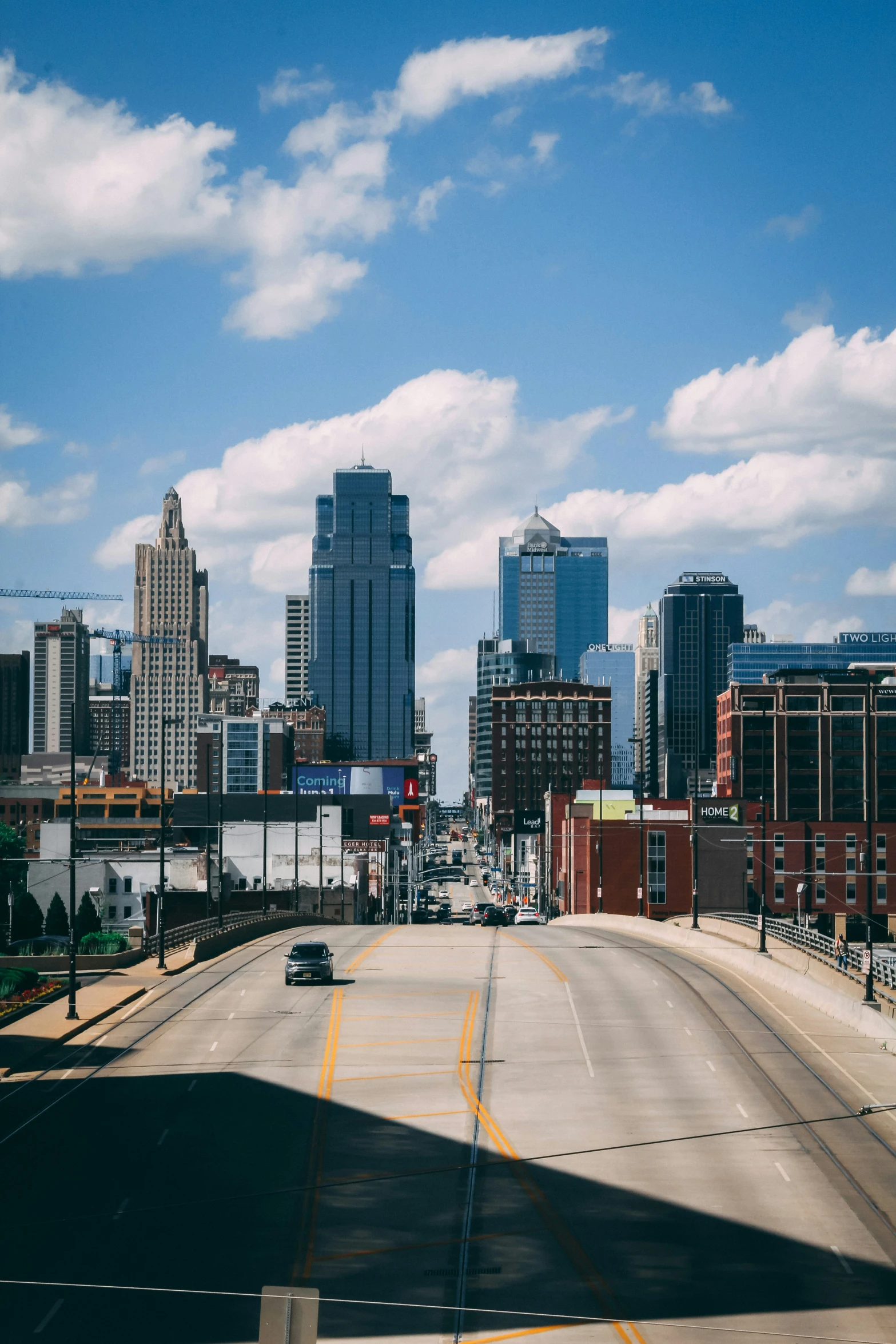 a view from a bridge of a large city skyline