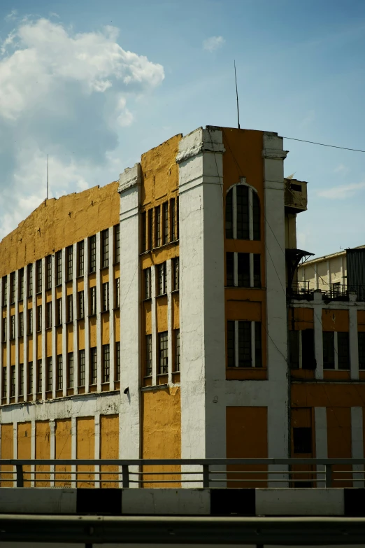 a tall building with yellow and white stripes