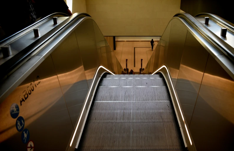 two escalator escalators one on top and the other bottom