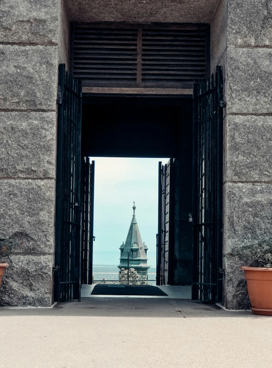 an open doorway leading to a very tall building