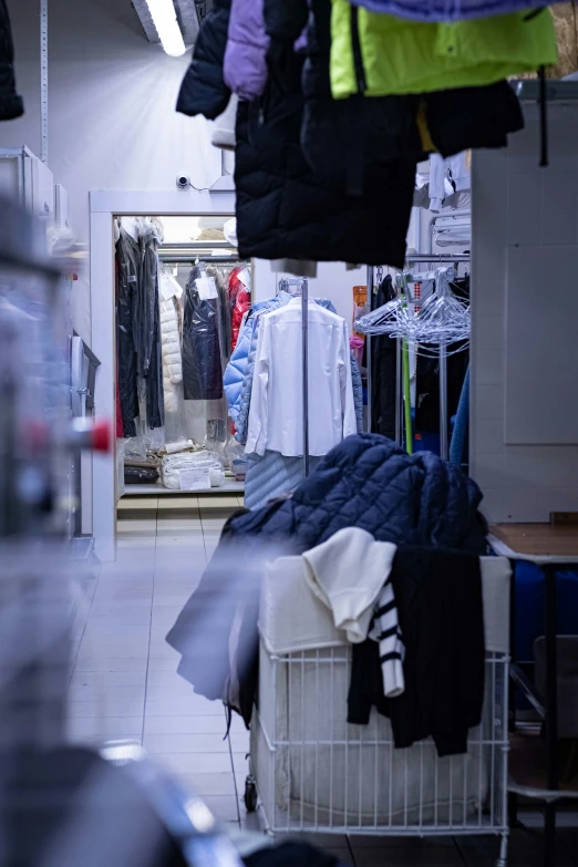 clothes and clothing hanging up in a room